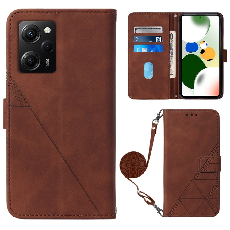 Brown crossbody flip leather phone case with diagonal seam, magnetic clasp, and wrist strap