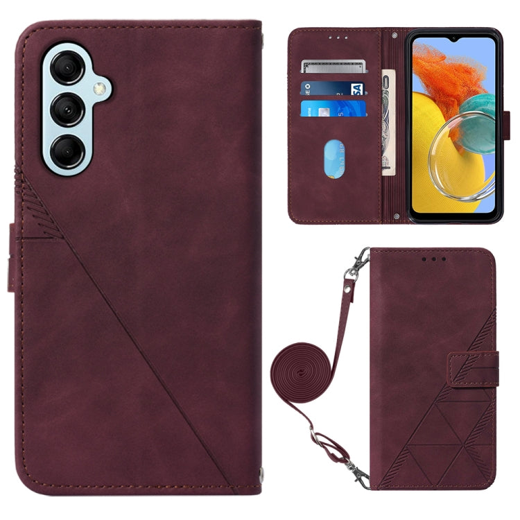Wine red crossbody flip leather phone case with diagonal seam, magnetic clasp, and wrist strap