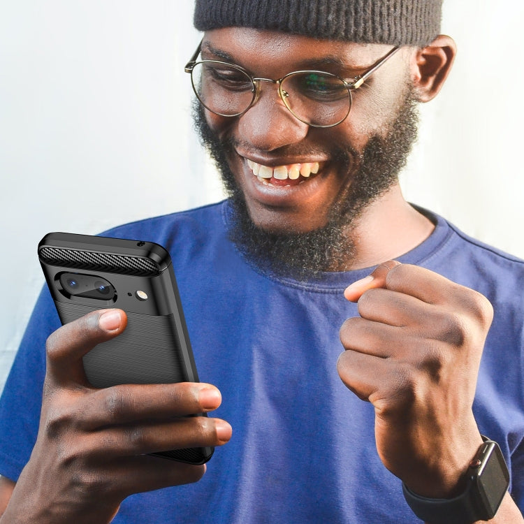 Carbon fiber textured TPU phone case on smartphone, held by a person