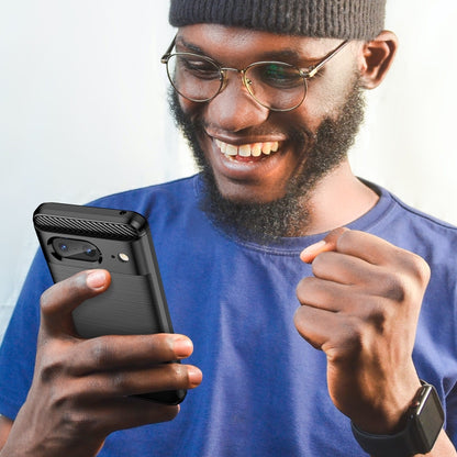 Carbon fiber textured TPU phone case on smartphone, held by a person