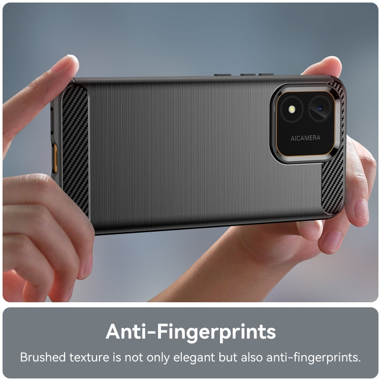 Black brushed carbon fiber TPU phone case held in hands; dual camera cutout visible