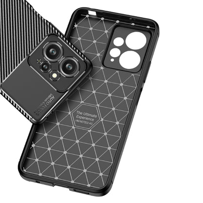 Shockproof TPU phone case with carbon fiber back and geometric pattern panel.