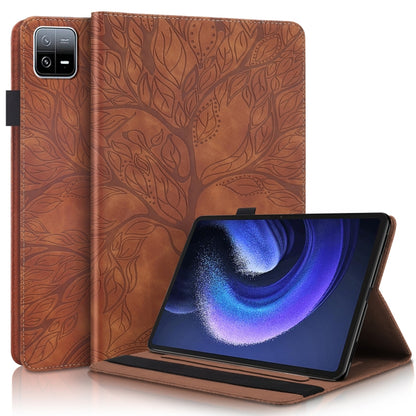 Brown embossed leather-style tablet flip case with stand, leaf pattern.