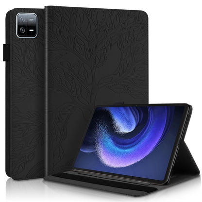 Black embossed leather-style tablet flip case with stand, leaf pattern.