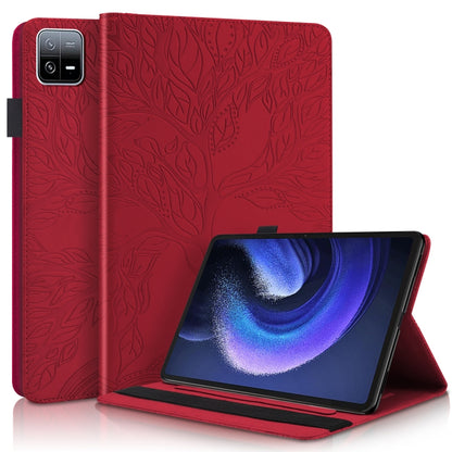 Red embossed leather-style tablet flip case with stand, leaf pattern.