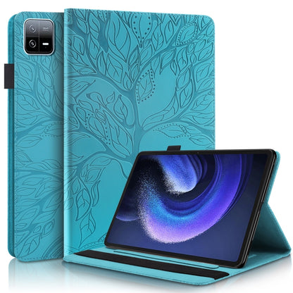 Teal embossed leather-style tablet flip case with stand, leaf pattern.