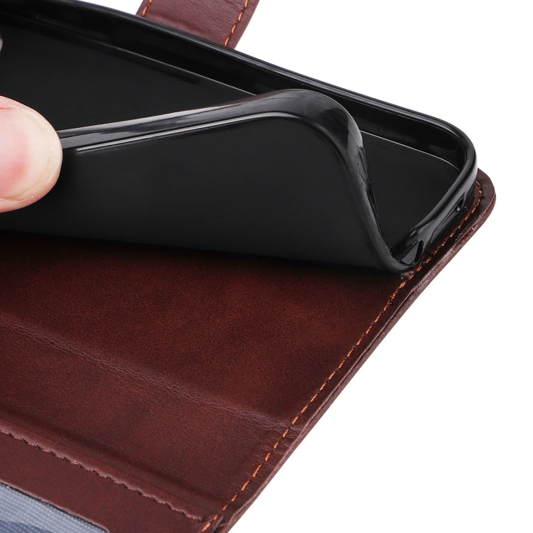 Brown leather flip phone case with stitched trim and secure inner shell