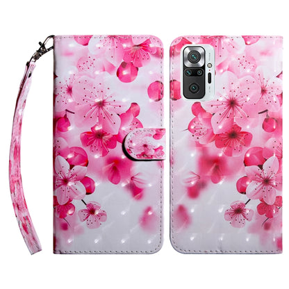 Leather phone case with pink cherry blossom pattern and wrist strap.