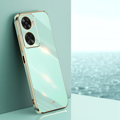 Electroplate TPU phone case with dual camera cutouts, mint green with gold trim