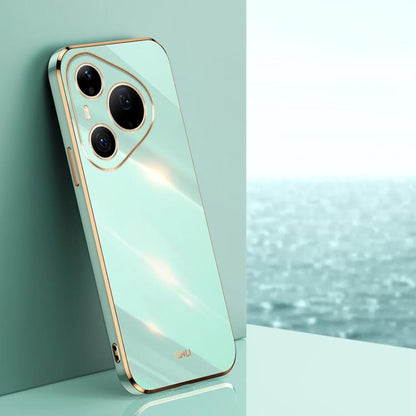 Mint green TPU phone case with gold-tone straight-edge trim and triple camera cutouts