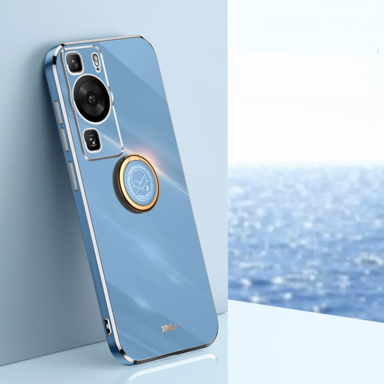Blue phone case with gold ring holder and camera cutouts