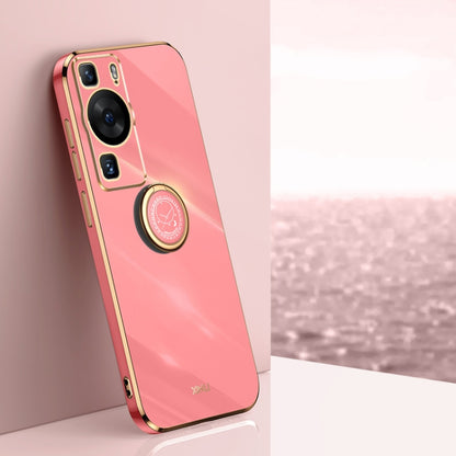 Coral pink phone case with gold ring holder and camera cutouts