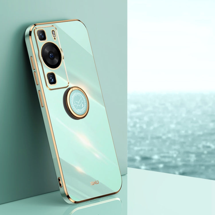 Light blue phone case with gold ring holder and camera cutouts