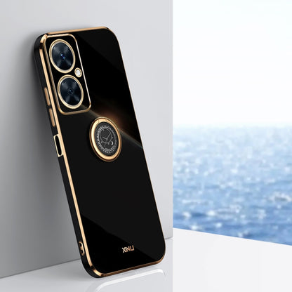 Black TPU phone case with ring holder and gold-tone edge accents.