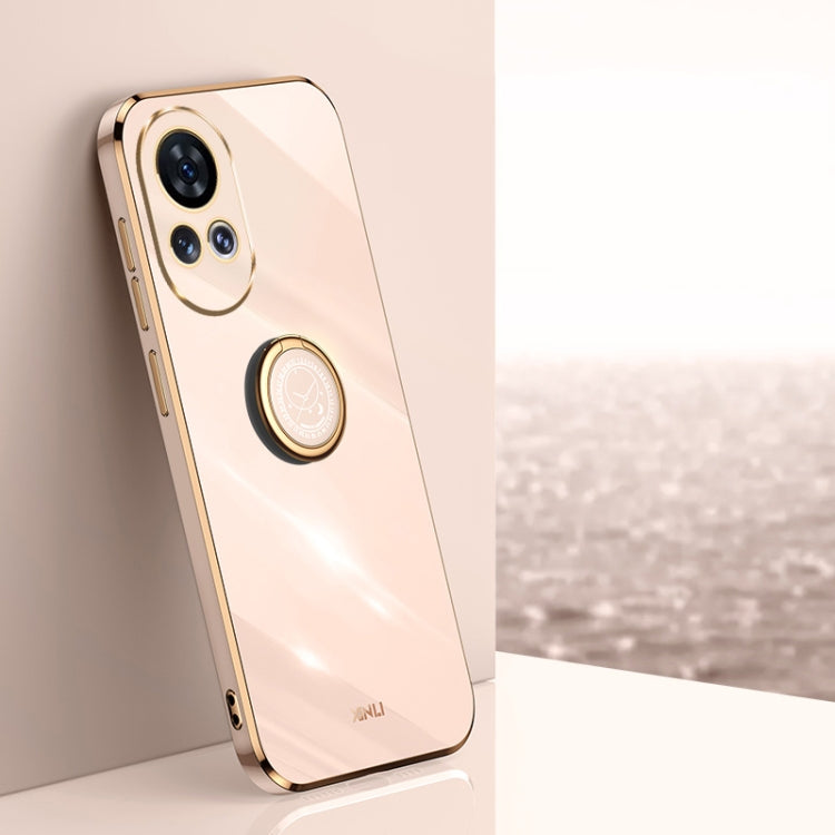 Light peach TPU phone case with ring holder and gold-tone edge accents.