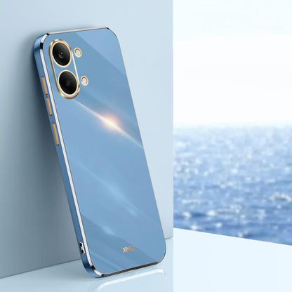 Electroplate TPU phone case in blue with gold-trim edges and dual camera cutouts.
