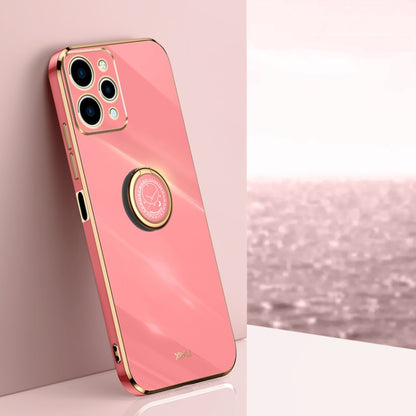 Coral pink TPU phone case with ring holder and gold-tone edges, with camera cutouts