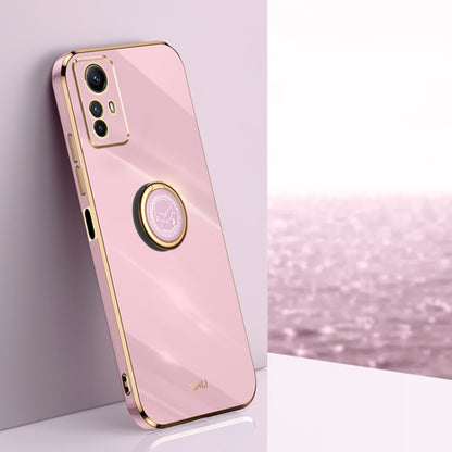 Pink TPU phone case with ring holder and gold-tone edges, with camera cutouts