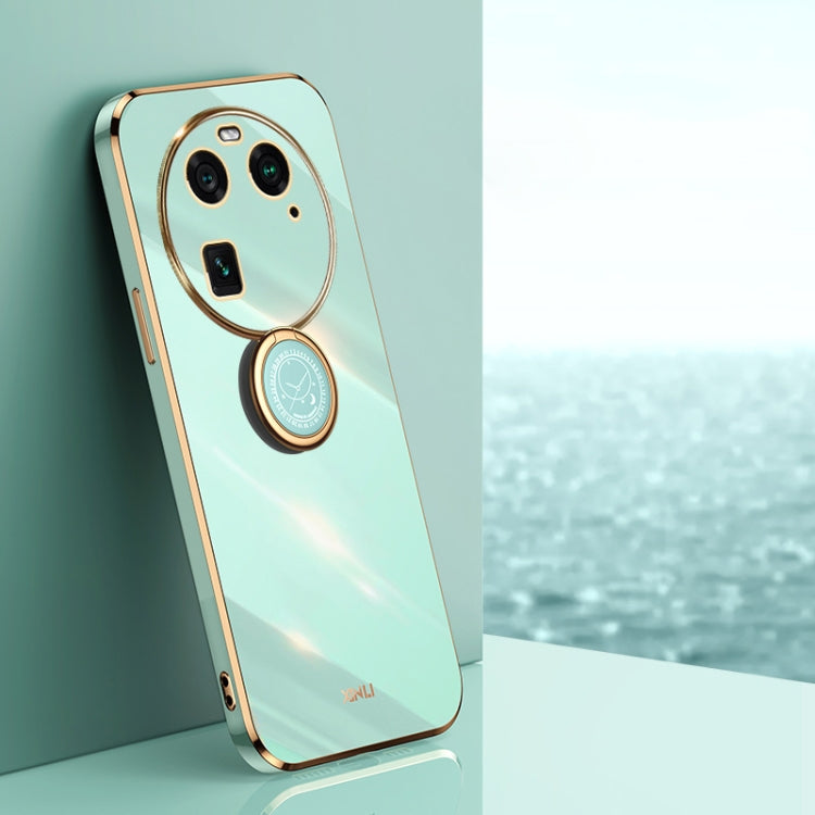 Mint green TPU phone case with gold ring holder and oval camera frame cutouts