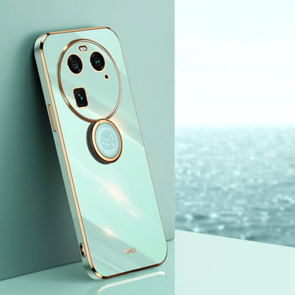 Mint green TPU phone case with gold ring holder and oval camera frame cutouts
