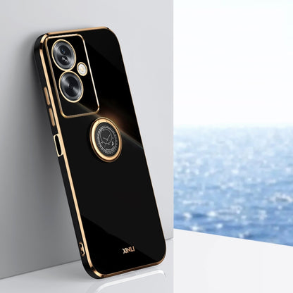 Black TPU phone case with gold edge and ring holder for secure grip