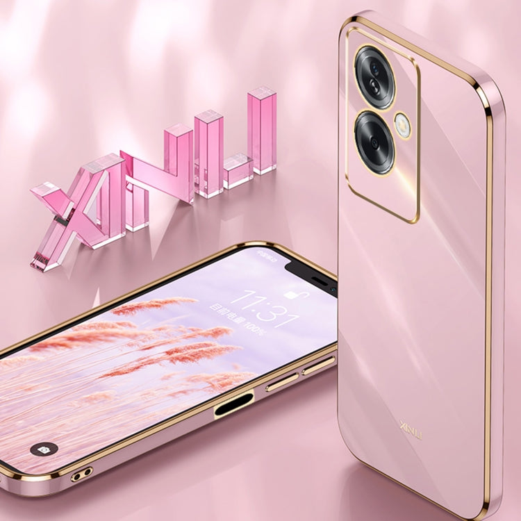 Pink TPU phone case with gold trim, camera cutouts, and ring holder