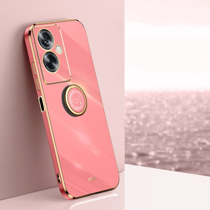 Pink TPU phone case with electroplated gold ring holder and camera cutouts