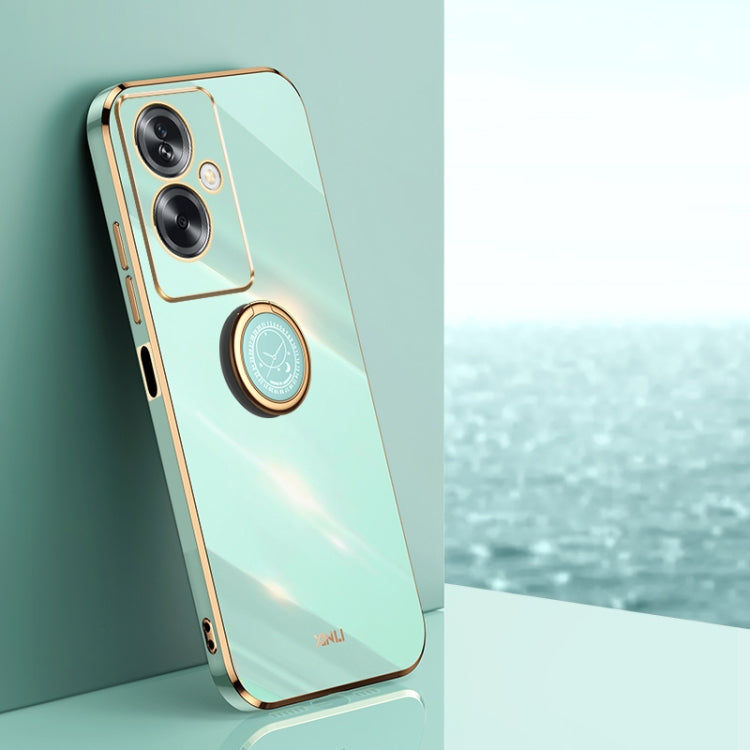 Mint green TPU phone case with electroplated gold ring holder and camera cutouts