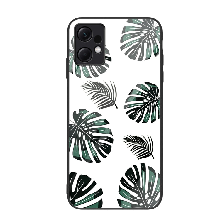 Glass phone case with black and green monstera leaf pattern on white