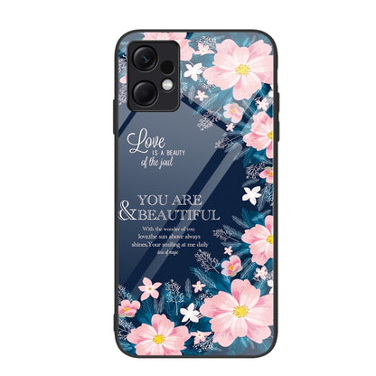 Glass phone case with pink floral artwork and quote-style script lettering