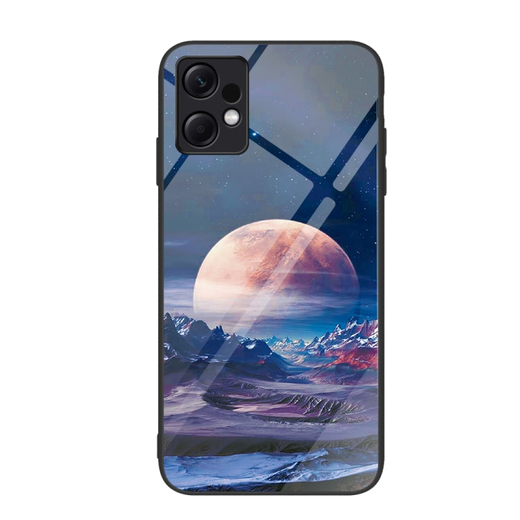 Glass phone case with blue landscape art featuring moon, mountains, and sky