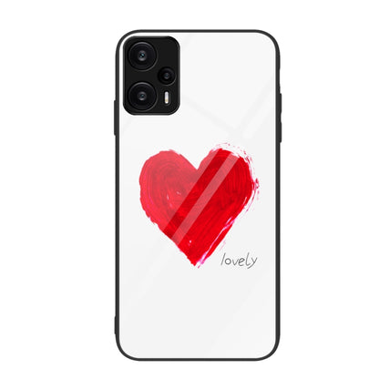 Glass phone case with red heart paint splash and small script reading “lovely”