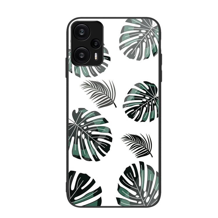 Monstera leaf pattern painted glass phone case in green and black on white.