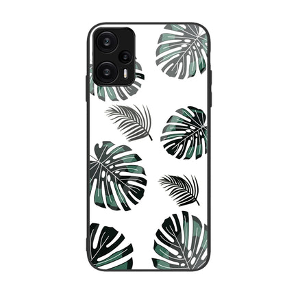Monstera leaf pattern painted glass phone case in green and black on white.