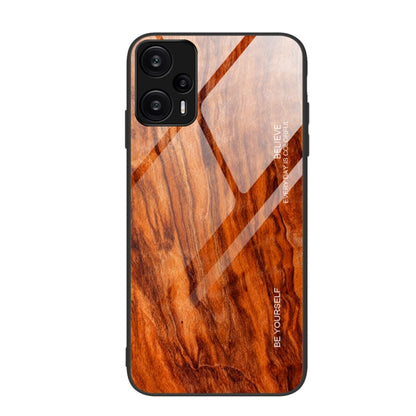 Orange wood grain TPU phone case with black bumper, diagonal geometric lines, camera cutout