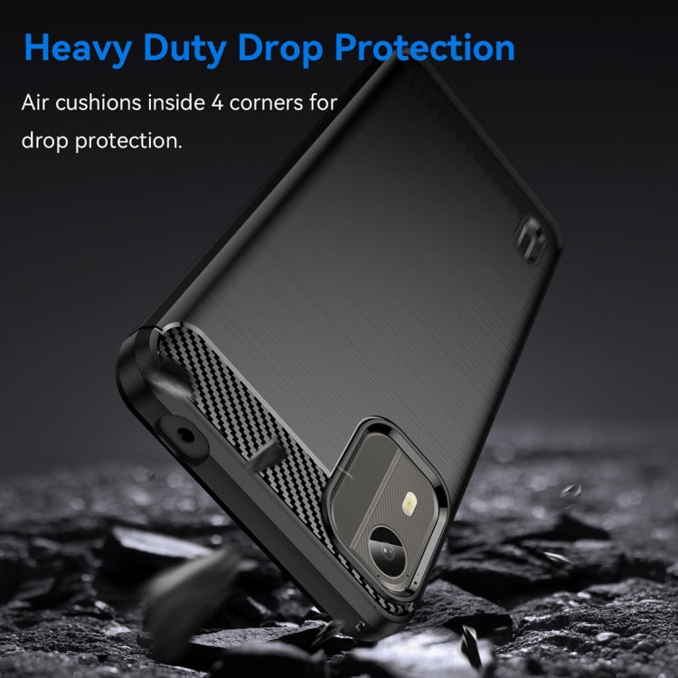 Brushed carbon fiber TPU phone case, dark black, angled close-up with camera area