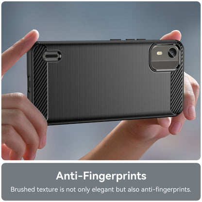 Brushed carbon fiber TPU phone case, black, back view held in hands