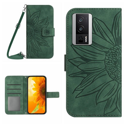 Green flower-embossed flip phone case with card slot and wrist lanyard strap