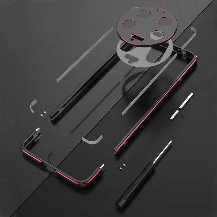Phone case components laid out, metal frame with camera lens cover parts