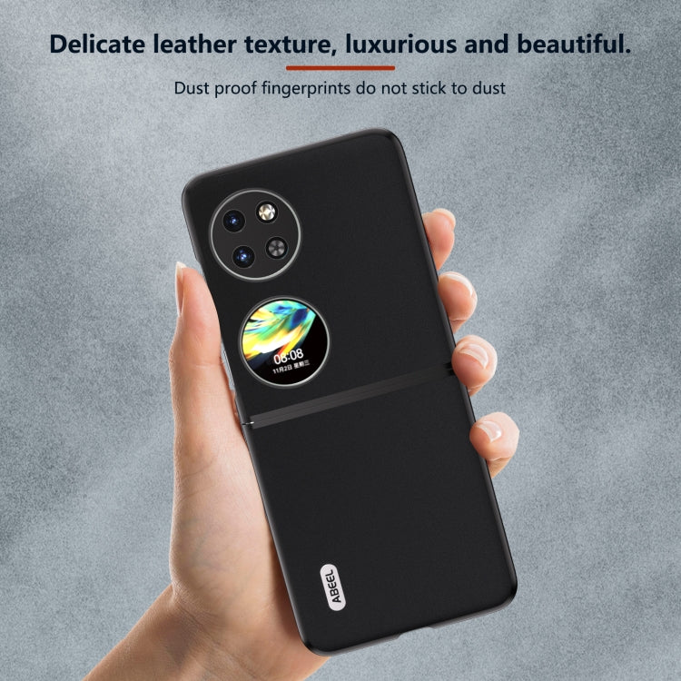 Black leather folding phone case held in hand with camera cutout and smooth texture.