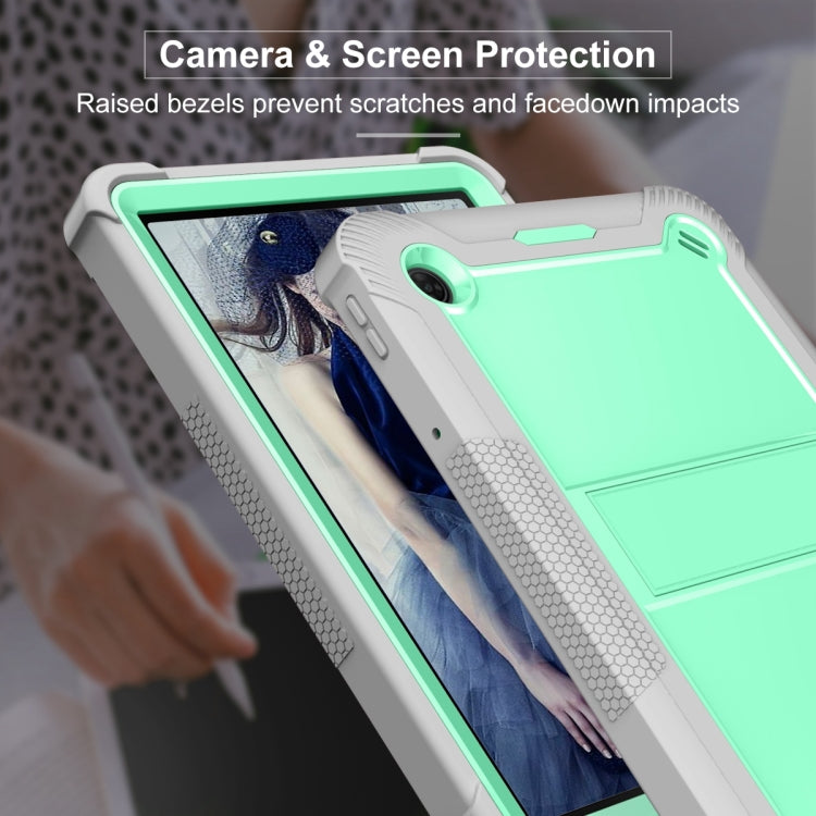 Mint green and gray tablet case with raised bezel and camera opening
