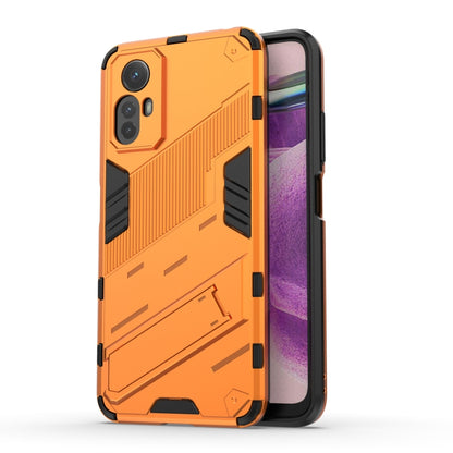 Armored phone case with orange hard shell and black grip panels, camera cutouts visible