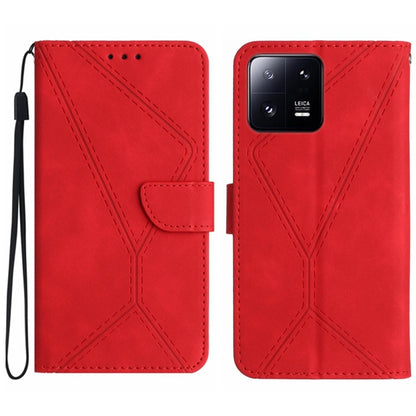 Red embossed leather phone case with flip cover, stitched design and front card pocket.