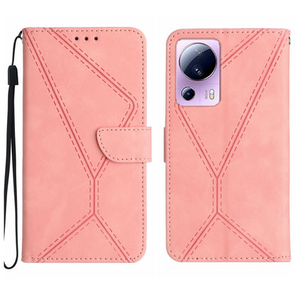 Pink embossed leather phone case with stitching pattern and card flap, wrist strap loop