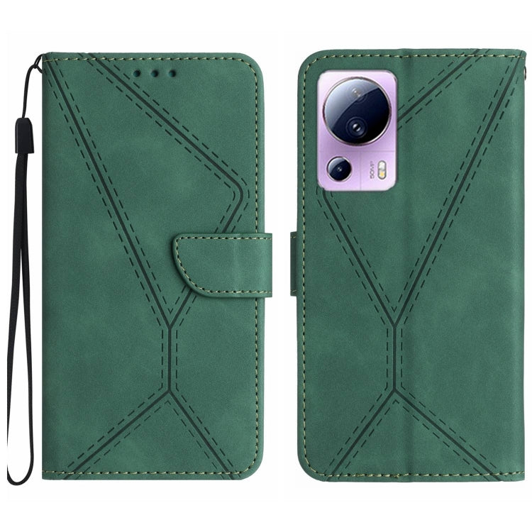 Green embossed leather phone case with stitching pattern and camera cutout, wrist strap loop