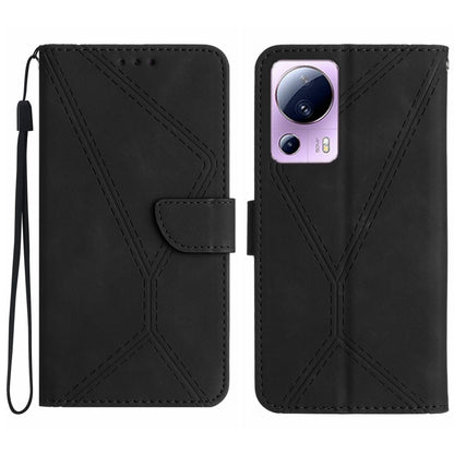 Black embossed leather phone case with stitching pattern and camera cutout, wrist strap loop