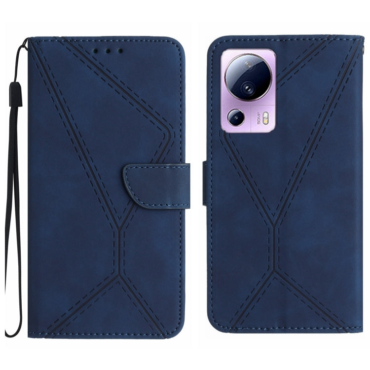 Blue embossed leather phone case with stitching pattern and camera cutout, wrist strap loop