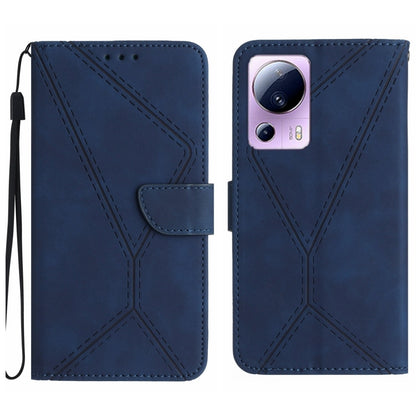 Blue embossed leather phone case with stitching pattern and camera cutout, wrist strap loop