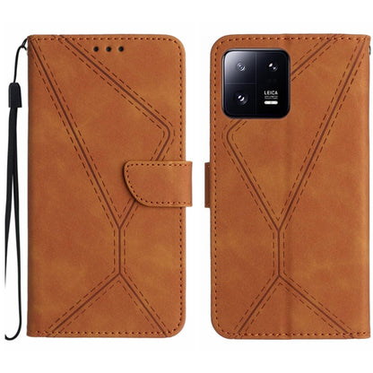 Brown embossed leather phone case with flip cover, stitched geometric design and wrist strap.