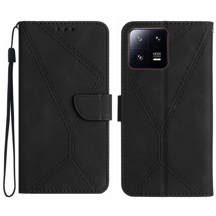 Black embossed leather phone case with flip cover, stitched geometric pattern and wrist strap.